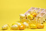 Yellow Easter eggs with a box