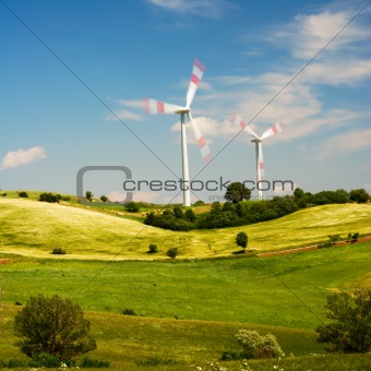 Summer landscape and wind turbines