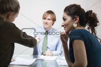 Three Businesspeople in Meeting