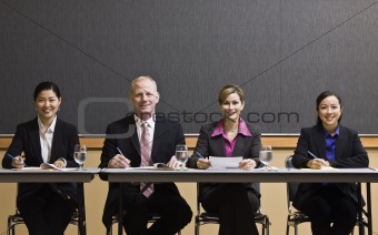 Business People Sitting at Table