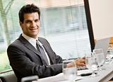 Man in Business Suit Smiling with laptop