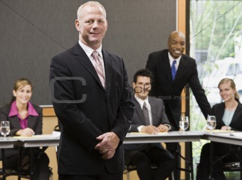 Businessman Standing and Smiling