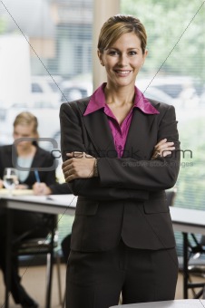 Businesswoman Standing and Smiling