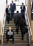 Businessman Sitting on Stairs