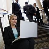 Businesswoman Sitting on Stairs