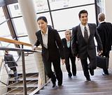 Business People Traversing Stairs