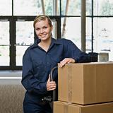Young Woman Moving Boxes
