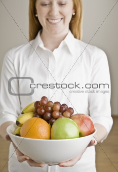 Young Woman with Bowl of Fruit
