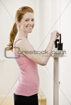 Young Woman Weighing Self