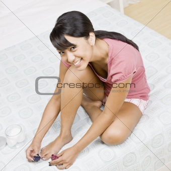 Young Woman Painting Toenails