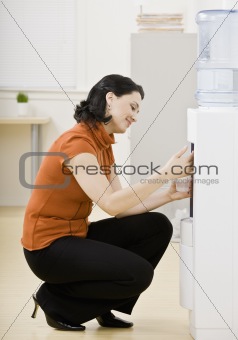 Businesswoman at Water Cooler