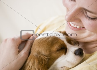 Young Woman Holding Dog