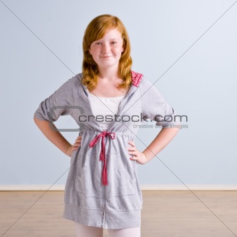 Young girl with hands on hips