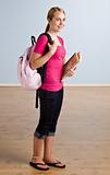 Teenage girl with backpack and books