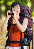 Woman with backpack and binoculars
