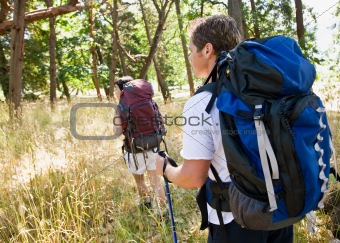 Couple hiking with backpacks