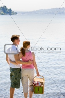 Couple having picnic near stream