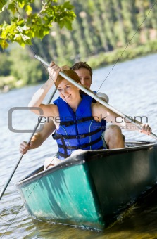 Couple rowing boat
