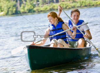 Couple rowing boat