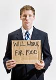 Businessman with sign ill work for food