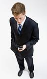 Businessman checking cell phone