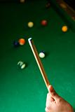 Hand Holding Pool Cue