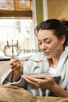Young Woman Eating Soup