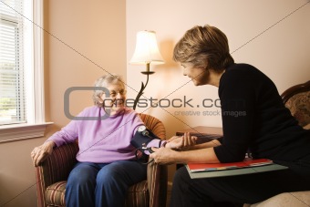 Elderly Woman Having Blood Pressure Taken