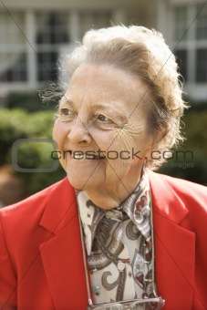 Elderly Woman in Red Coat Outdoors Smiling