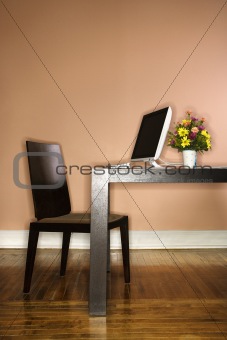 Computer on Table with Flowers