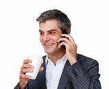 Businessman on phone and drinking a coffee 