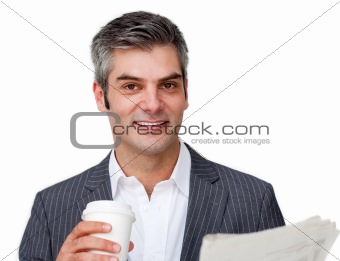 Attractive businessman reading a newspaper 