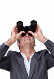 Positive Businessman looking up through a pair of binoculars 
