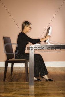 Attractive Young Businesswoman Looking at Computer Surprised