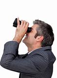 Visionary businessman looking through a pair of binoculars