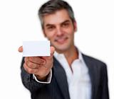 Positive businessman showing a white card 