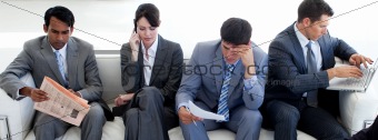 Multi-ethnic business people sitting in a waiting room