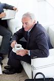 Businessman drinking coffee and waiting for a job interview