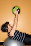 Woman Exercising with Gym Balls