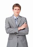 Confident businessman with folded arms 