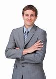 Attractive businessman with folded arms smiling at the camera