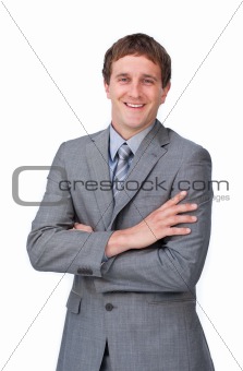 Positive businessman with folded arms