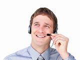 Assertive businessmnan with headset on looking up 