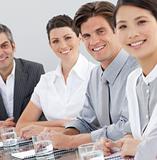 International business people sitting around a conference table