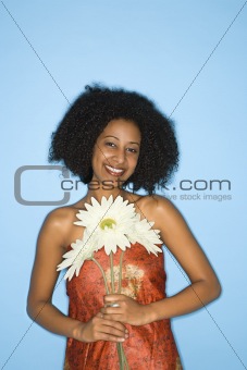 Woman holding flowers.