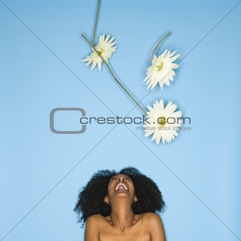 Woman with flowers iin air.