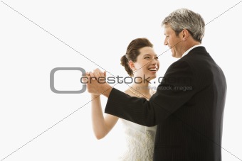 Bride and groom dancing.