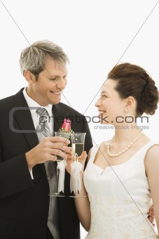 Bride and groom toasting.