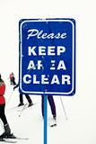 Keep area clear sign at ski slope.