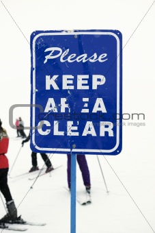 Keep area clear sign at ski slope.